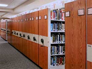 Movable shelving for libraries